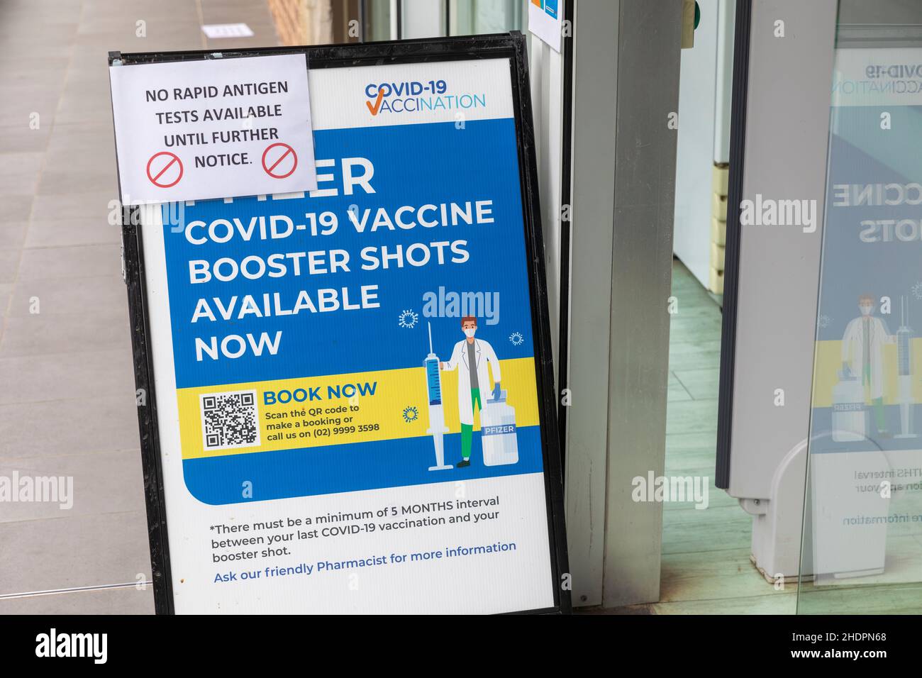 Australian chemist pharmacy offering Pfizer booster vaccinations but advising they have sold out of rapid antigen tests for covid 19,Sydney Stock Photo