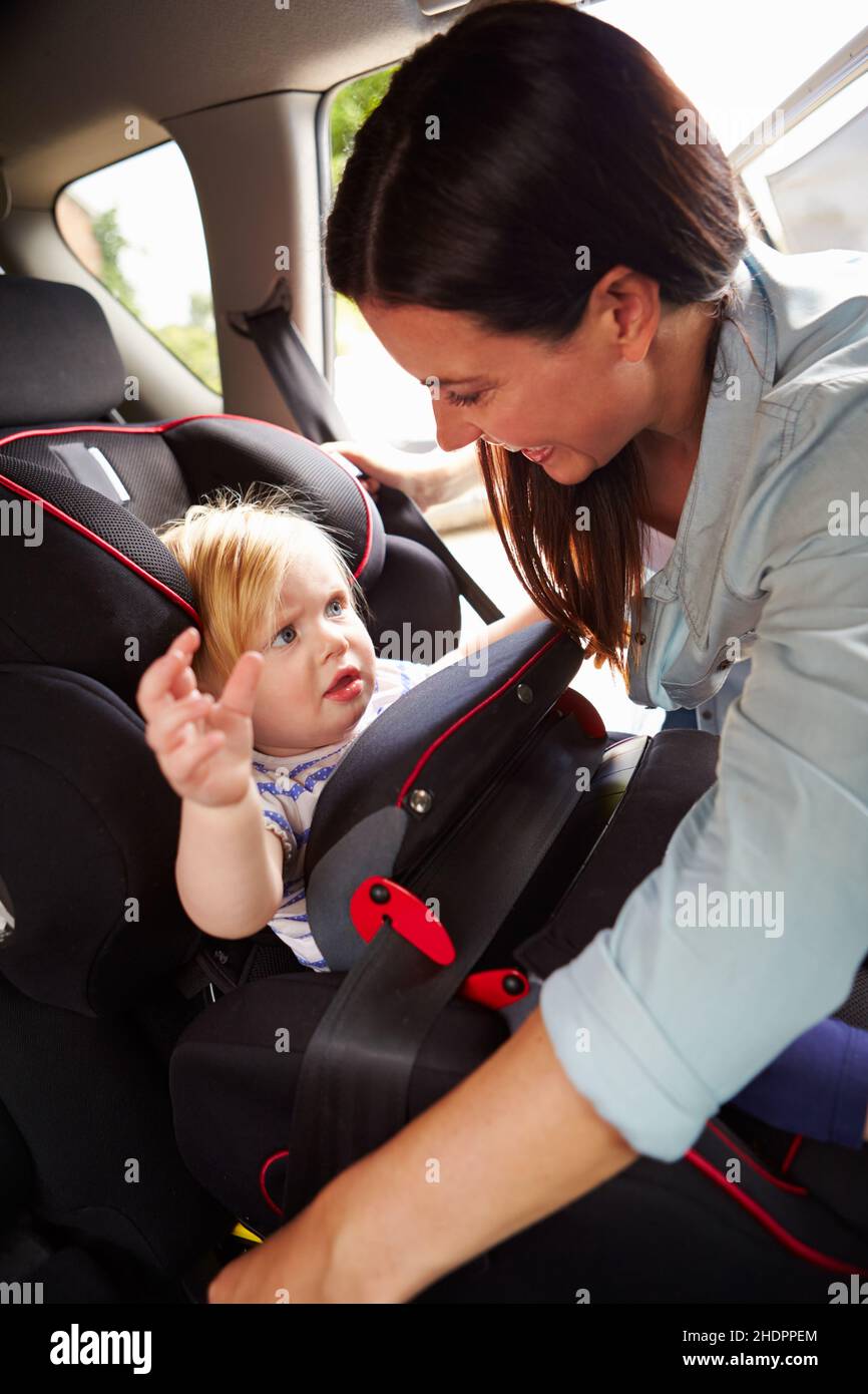 child, mother, traffic safety, car seat, children, childs, kid, kids, mom, mothers, mum, traffic safeties, car seats Stock Photo