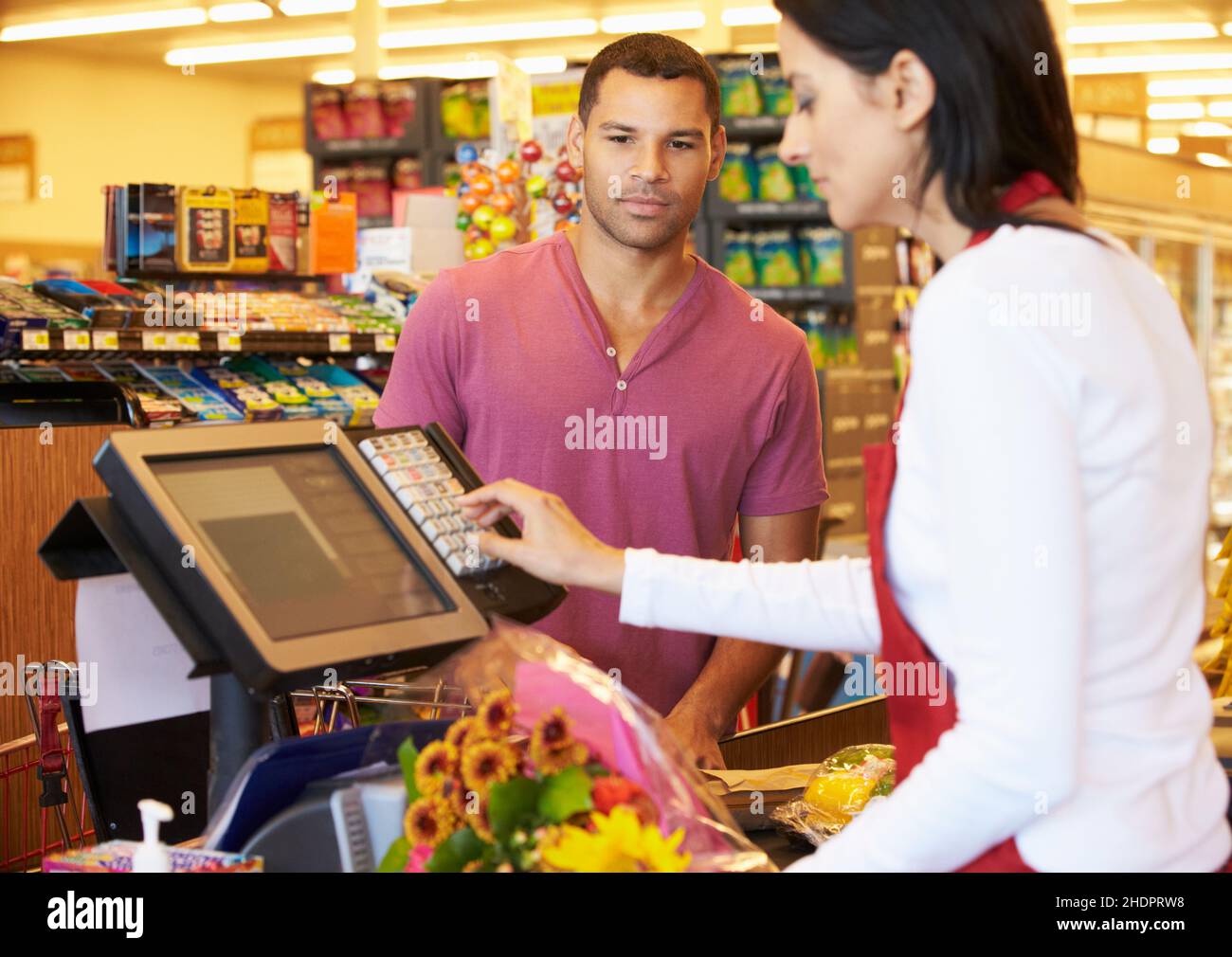 Female cashiers at checkout counter hi res stock photography and images Female cashiers at checkout counter hi res stock photography and images