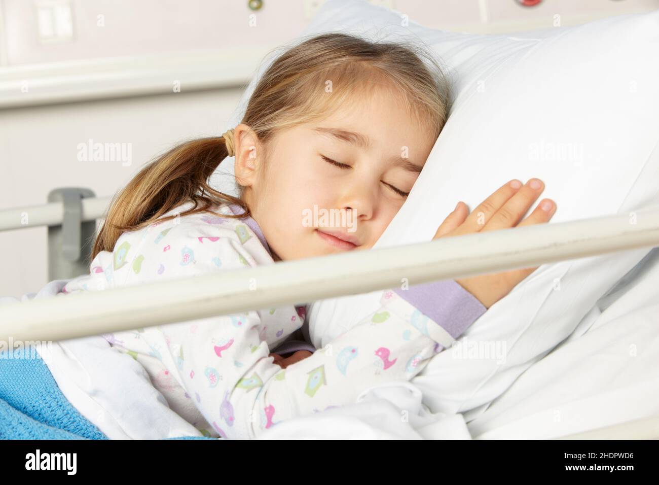 child, girl, sleeping, patient, hospital bed, children, childs, kid, kids, girls, sleep, to be asleep, to sleep, patients, clinic, hospital beds, Stock Photo
