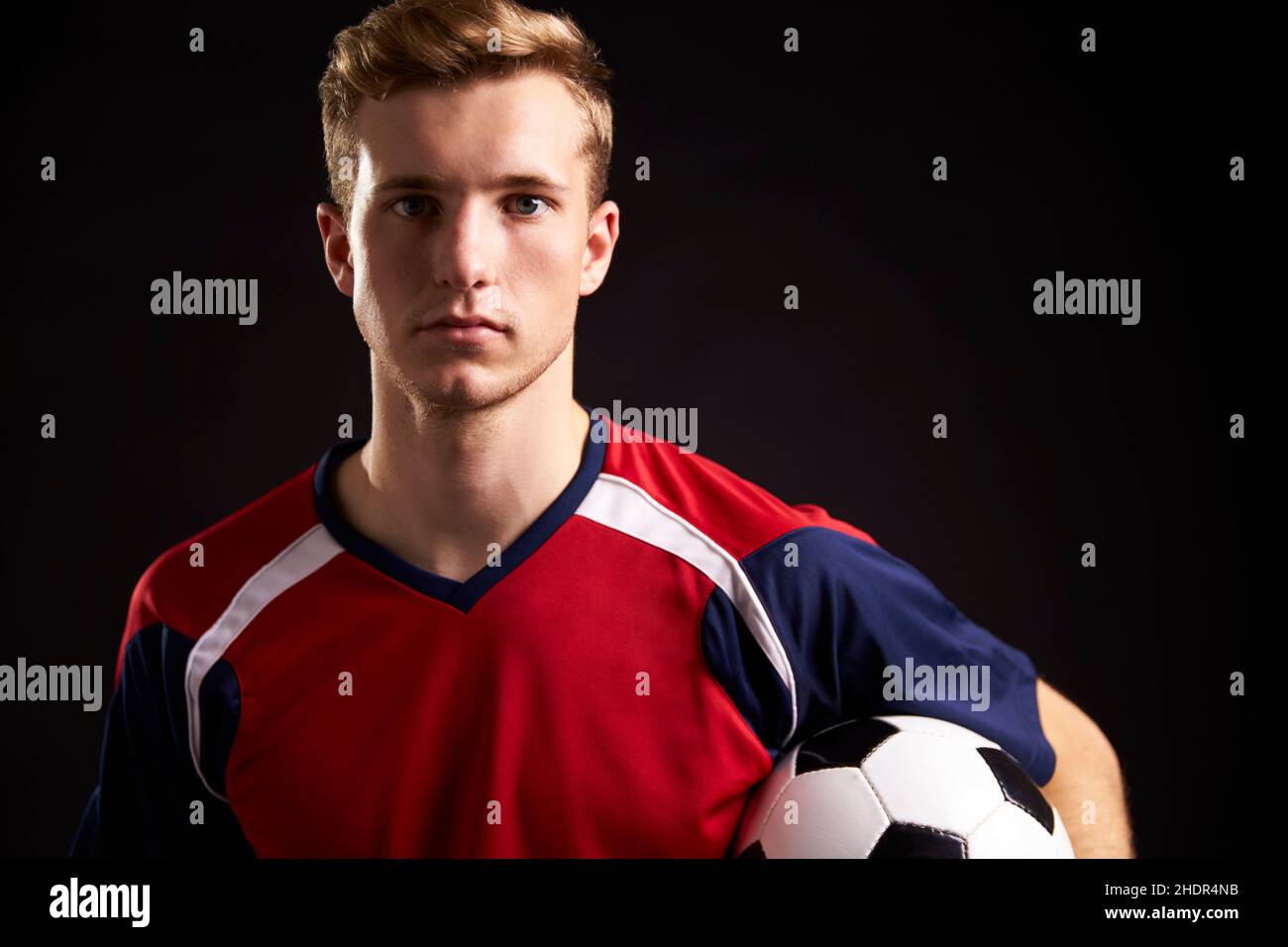 Professional Soccer Player Blue White Uniform Ball Football Pitch Stadium  Stock Photo by ©VitalikRadko 371872680