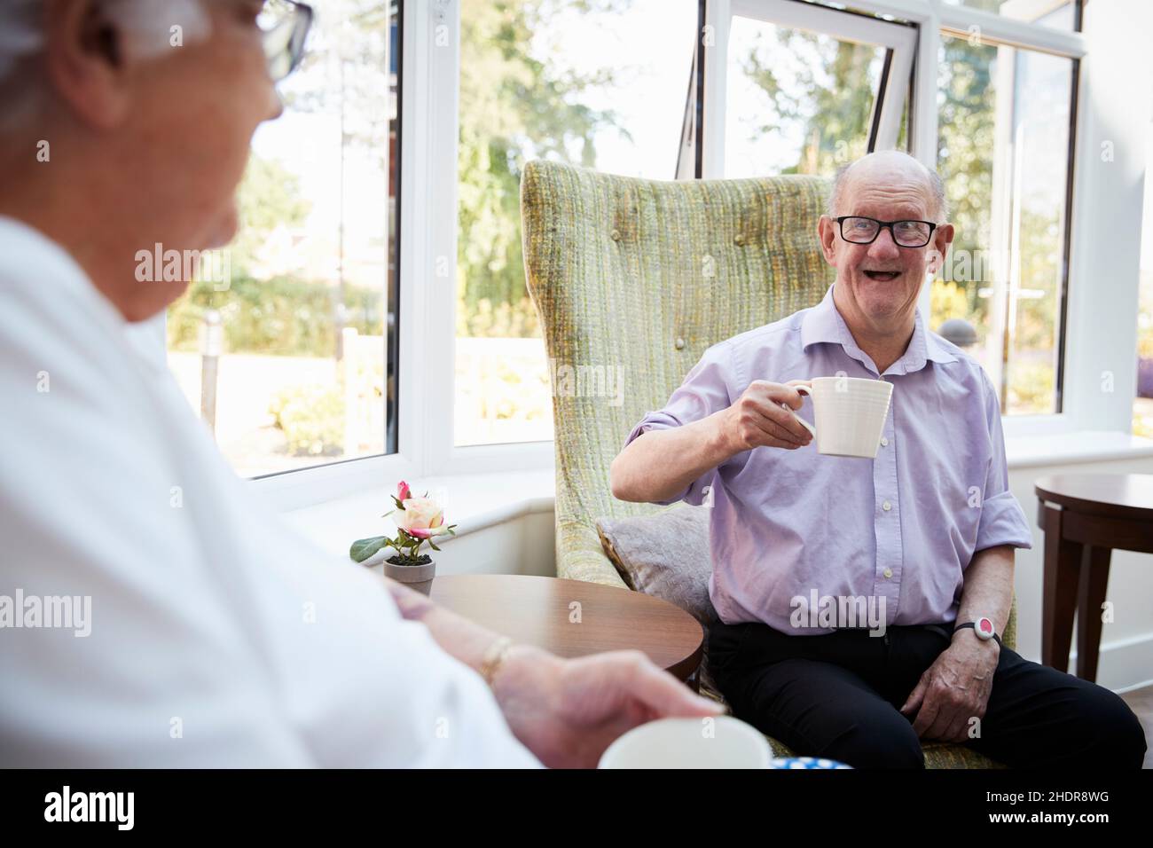 Elderly people eating assisted living hires stock photography and