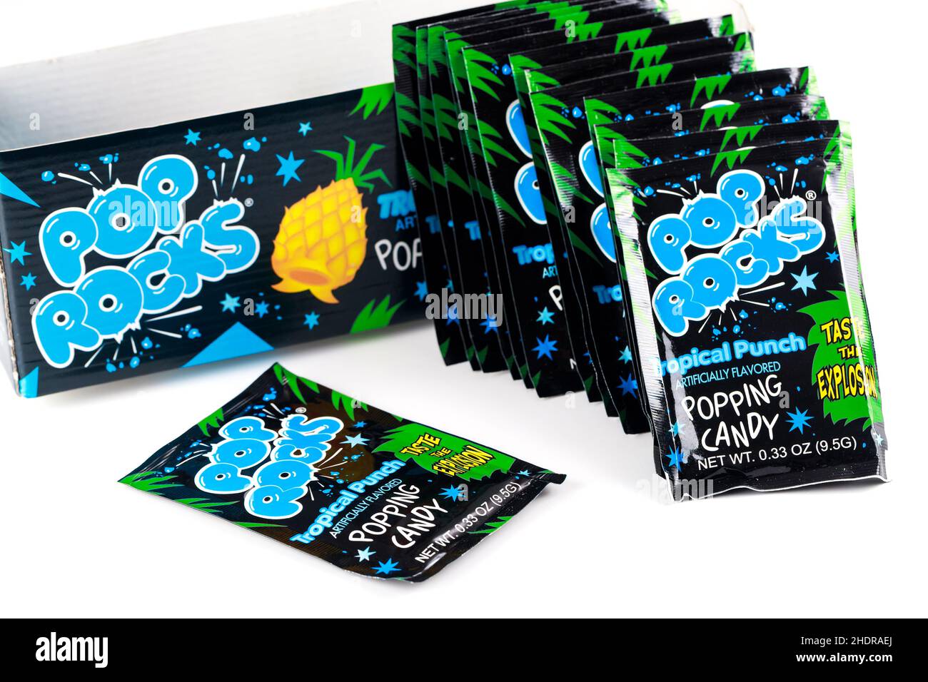 May 4, 2021. New York, US. Many packages of Pop Rocks tropical punch candy on white background. Stock Photo