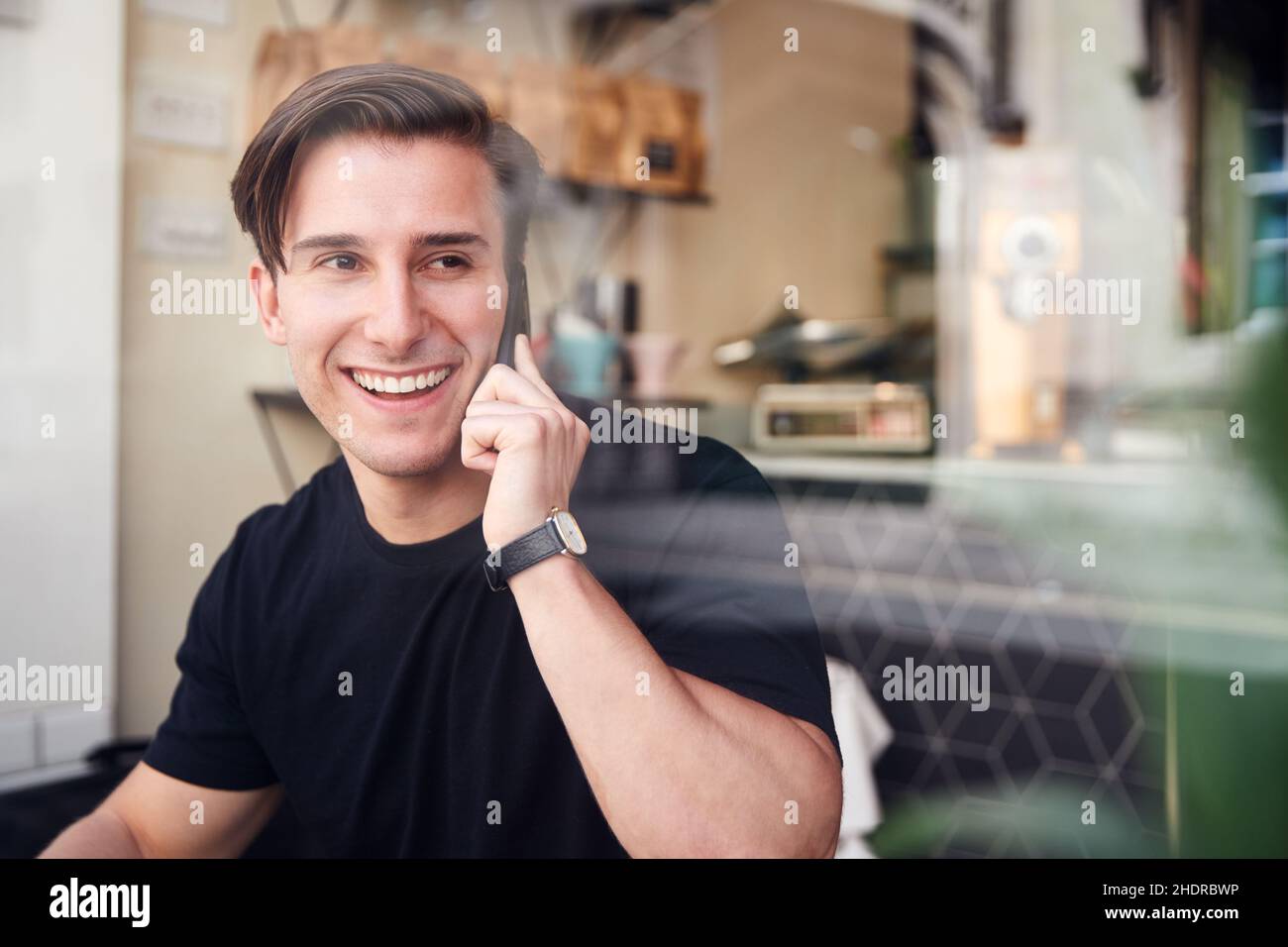 man, smiling, cafe, on the phone, guy, men, smile, cafes, on the phones Stock Photo