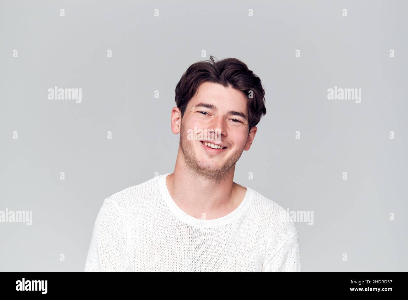 Smiling young guy in hi-res stock photography and images - Alamy