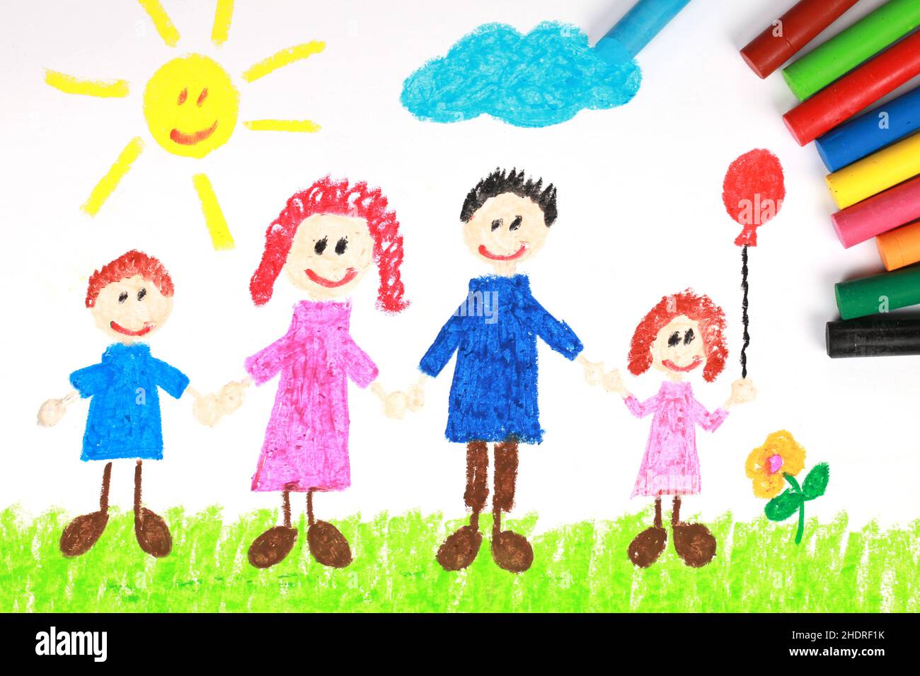 Kids Drawing Of Family And Colored Pencils On Wooden Table Stock Photo,  Picture and Royalty Free Image. Image 27543536.