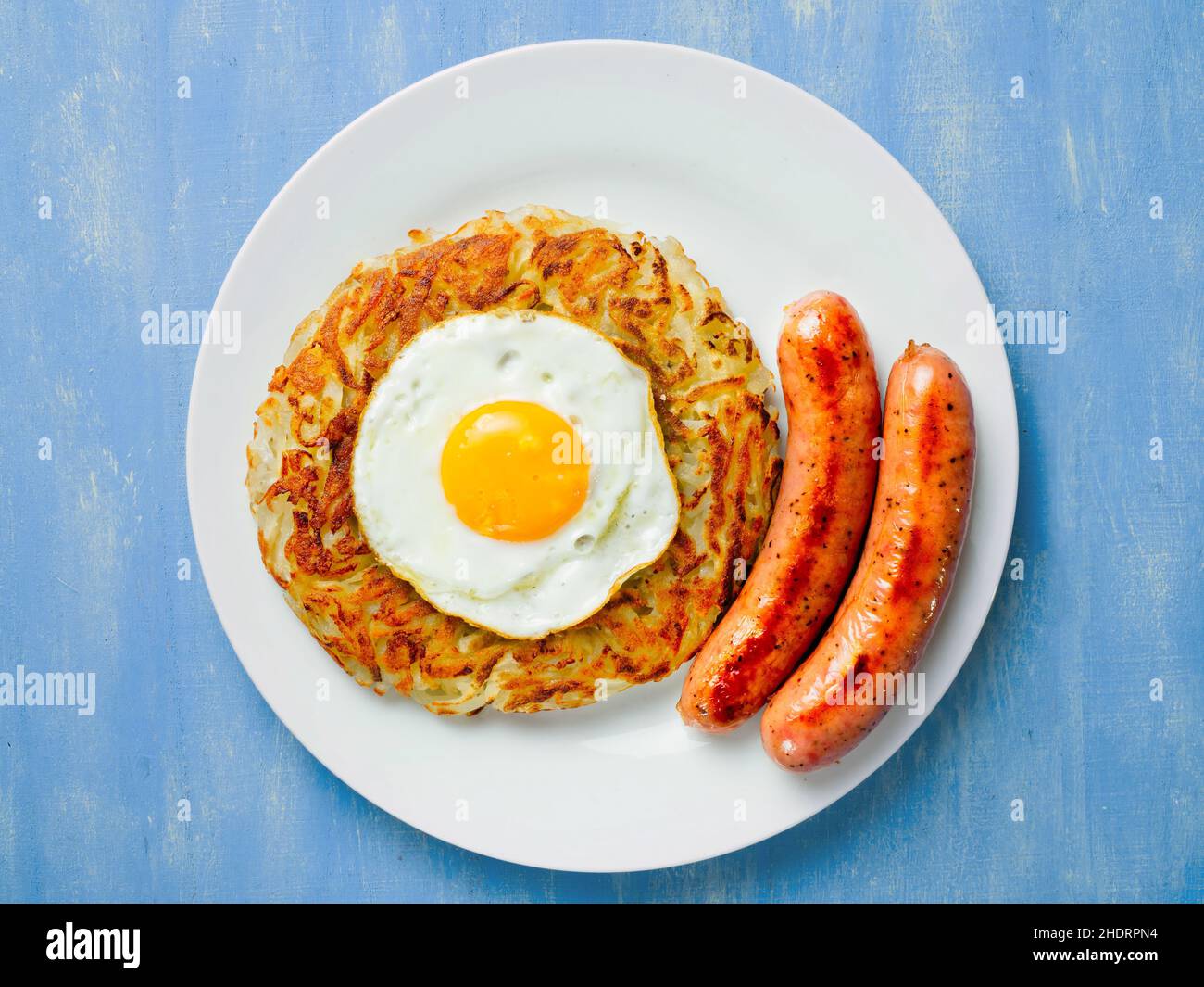 fried egg, sausages, potato pancakes, fried eggs, sausage, latke Stock