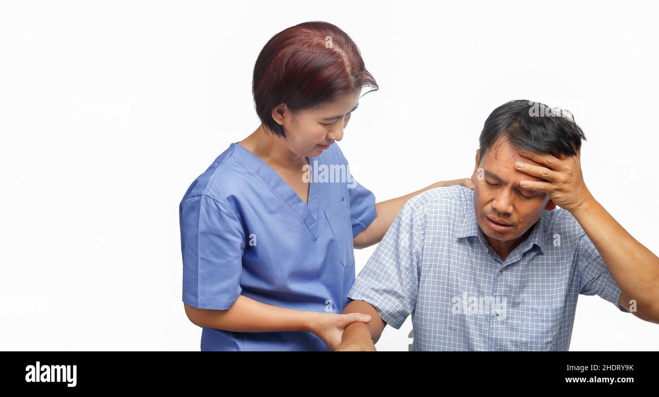 Caregiver take care patient man , Migraine headaches. Stock Photo