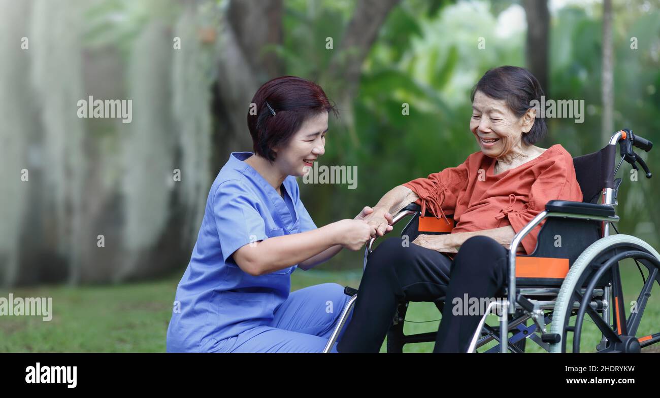 elderly woman happiness talking with caregiver Stock Photo