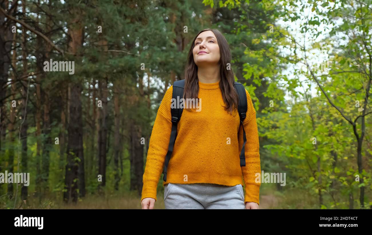 Old woman walks along road hi-res stock photography and images - Alamy