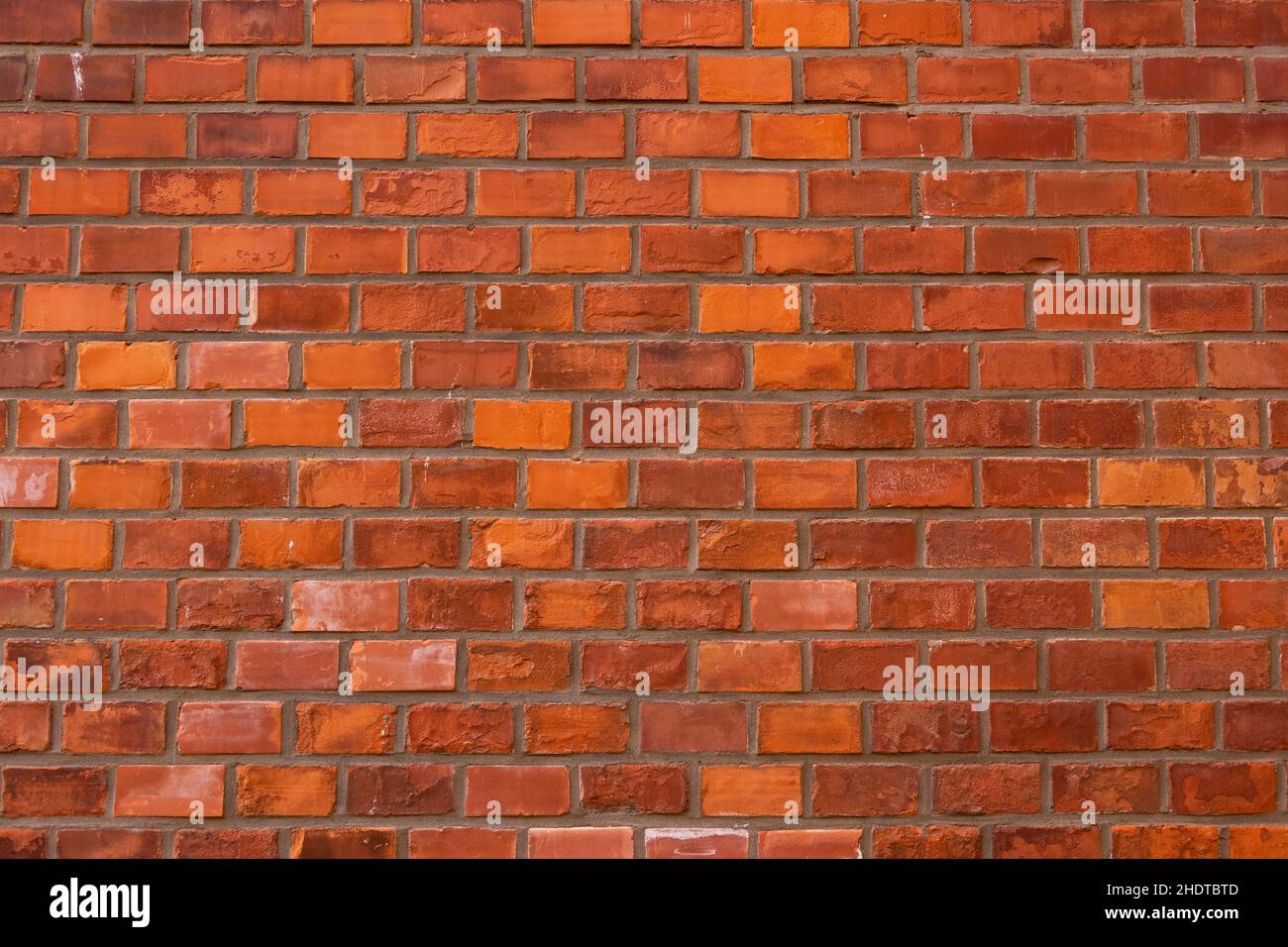 Red brick wall texture grunge background with regular pattern. Stock Photo