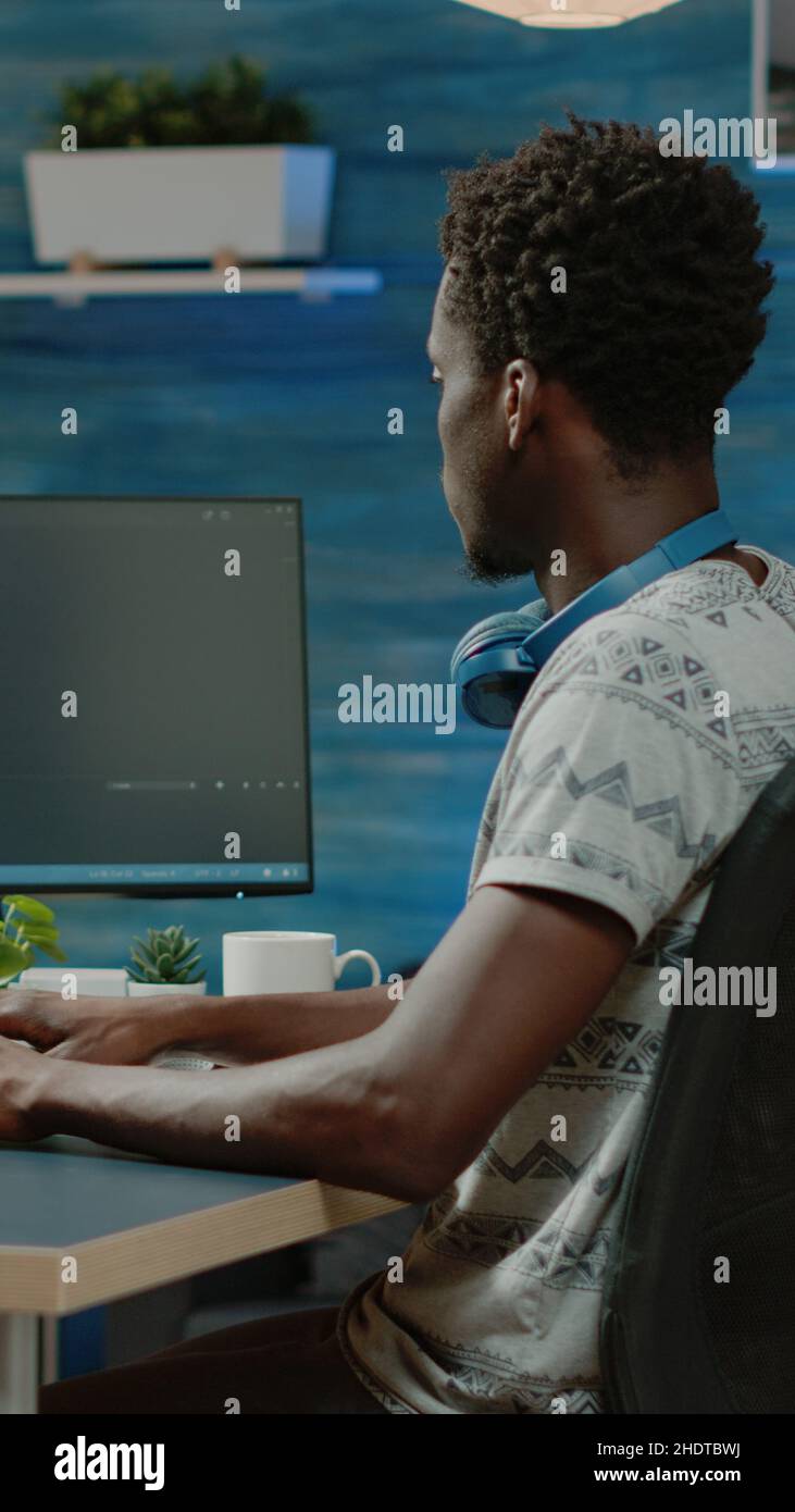 Programmer using binary code for website interface development on computer. Person coding system for cybersecurity with firewall data. Coder programming security for software app Stock Photo