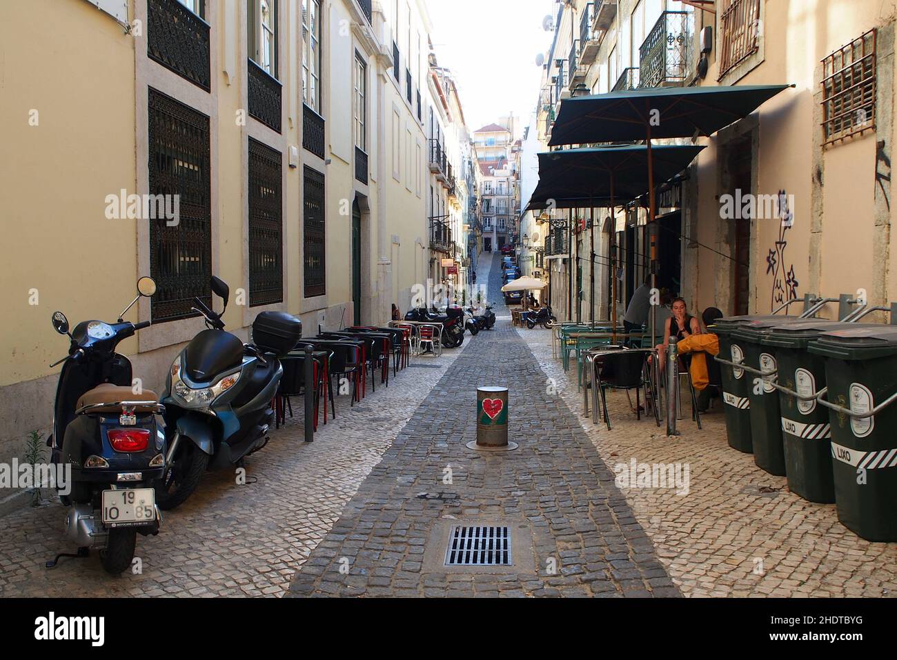 Cobblestone street in Bairro Alto, view in afternoon shadows, Lisbon ...
