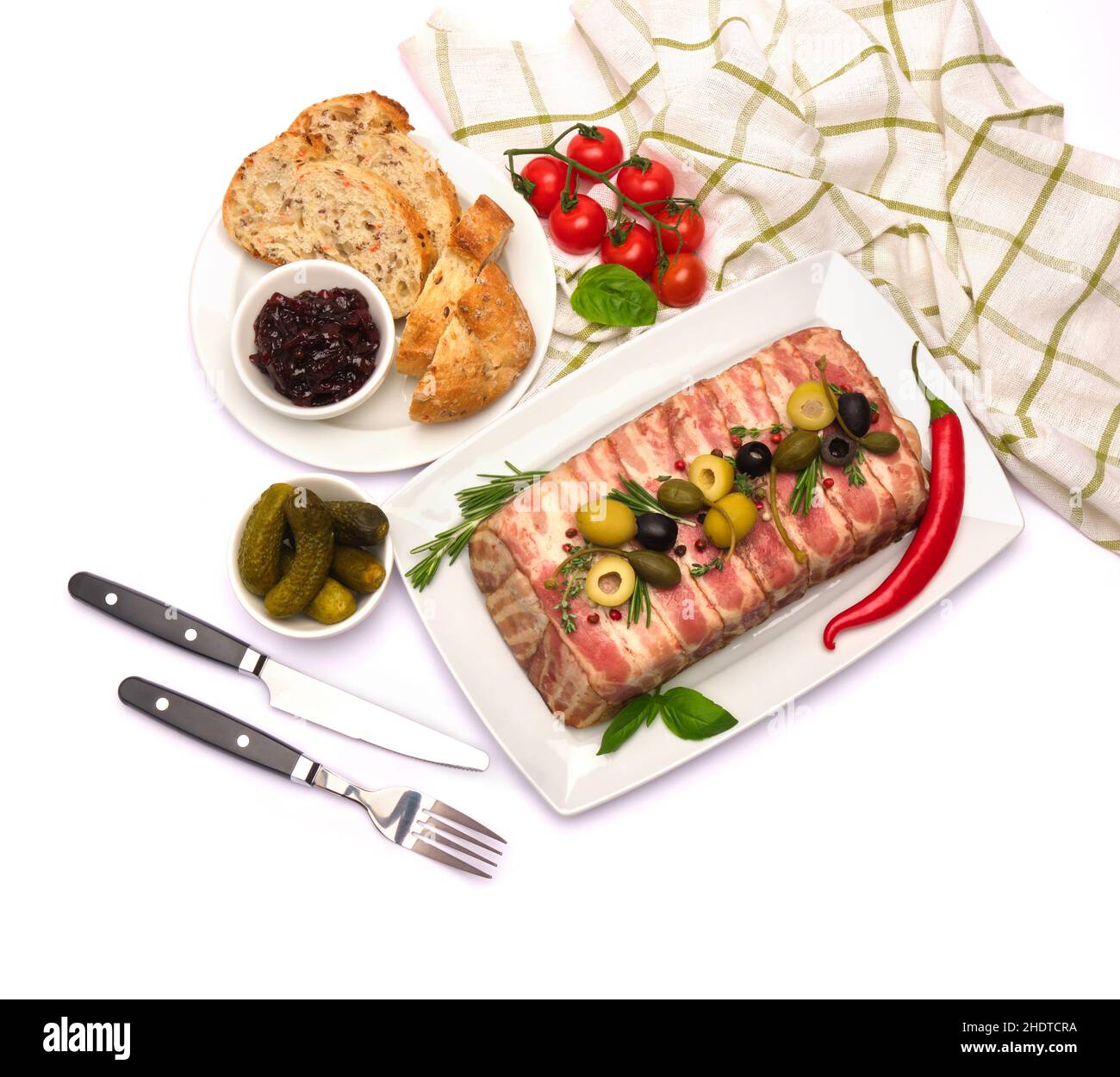 Traditional French terrine covered with bacon isolated on white