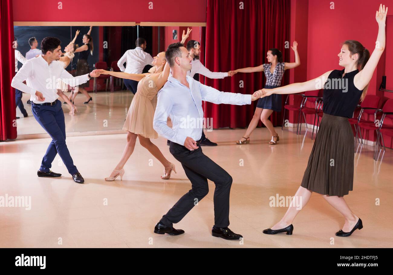 People practicing vigorous lindy hop movements Stock Photo