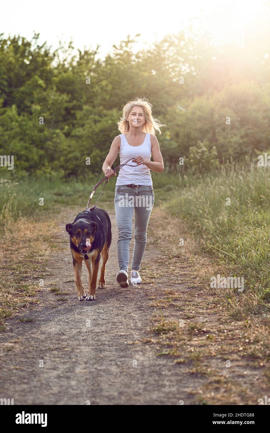 woman, dog, walk the dog, female, ladies, lady, women, dogs, walk the dogs Stock Photo