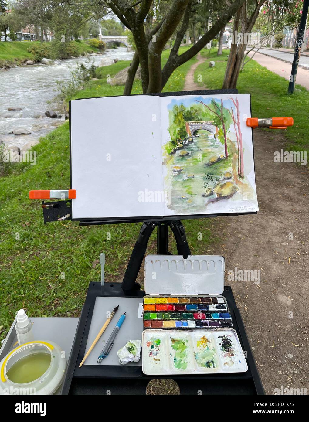 Honolulu, Hawaii - Dec 7, 2021 - Artist painting and paint pallete show scene being painted. Stock Photo