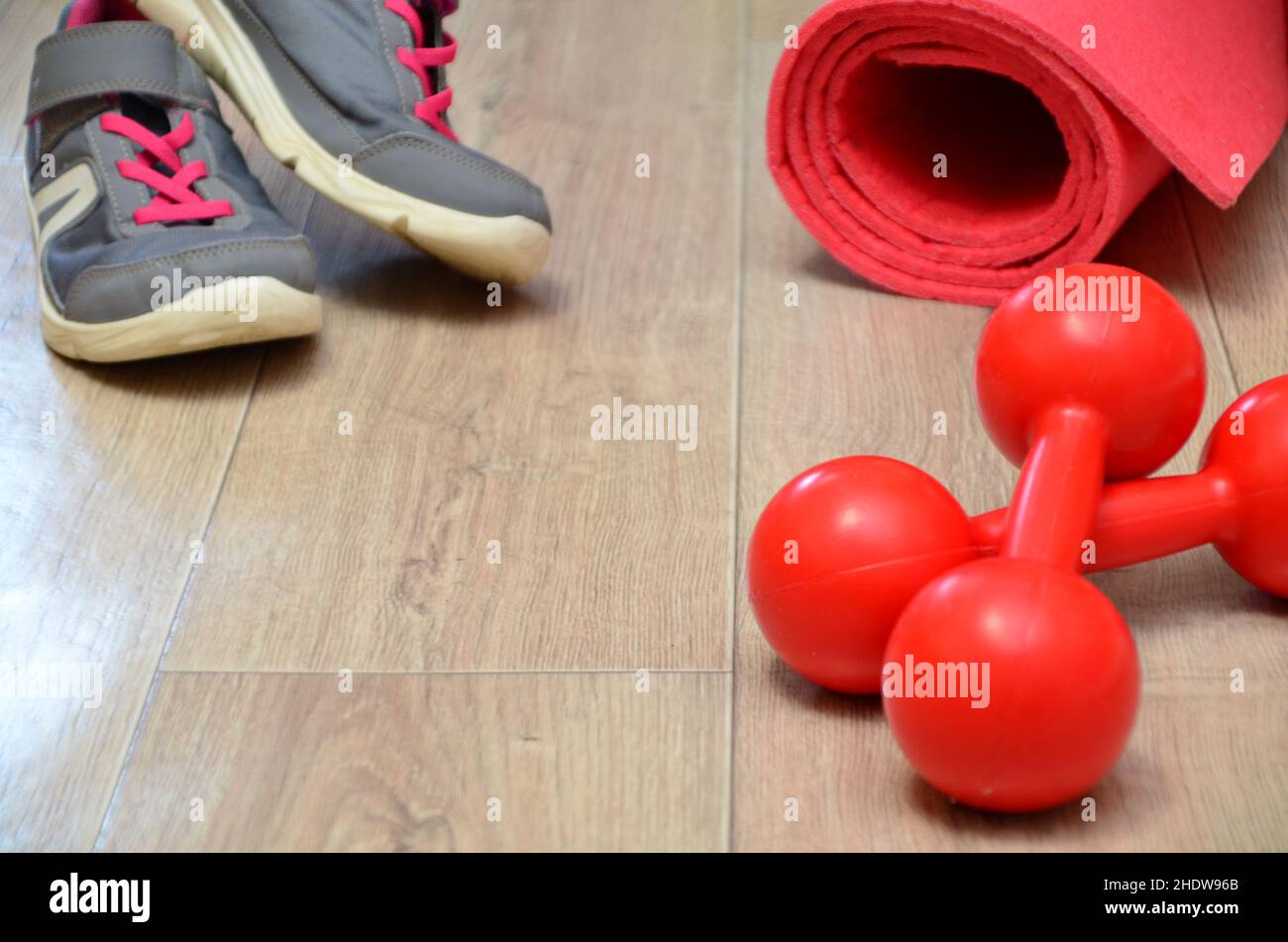 Premium Photo  Red jumping rope sports shoes and towel on dark background.  training equipment healthy lifestyle.