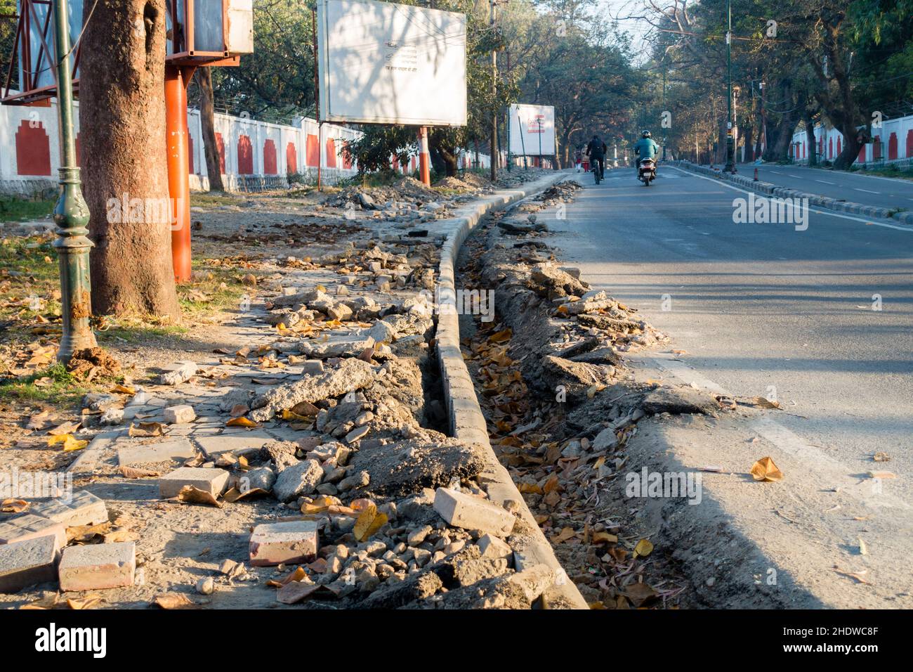 A close-up shot of dug-up drainage alongside the road. Under-construction drainage alongside the road in India. Stock Photo