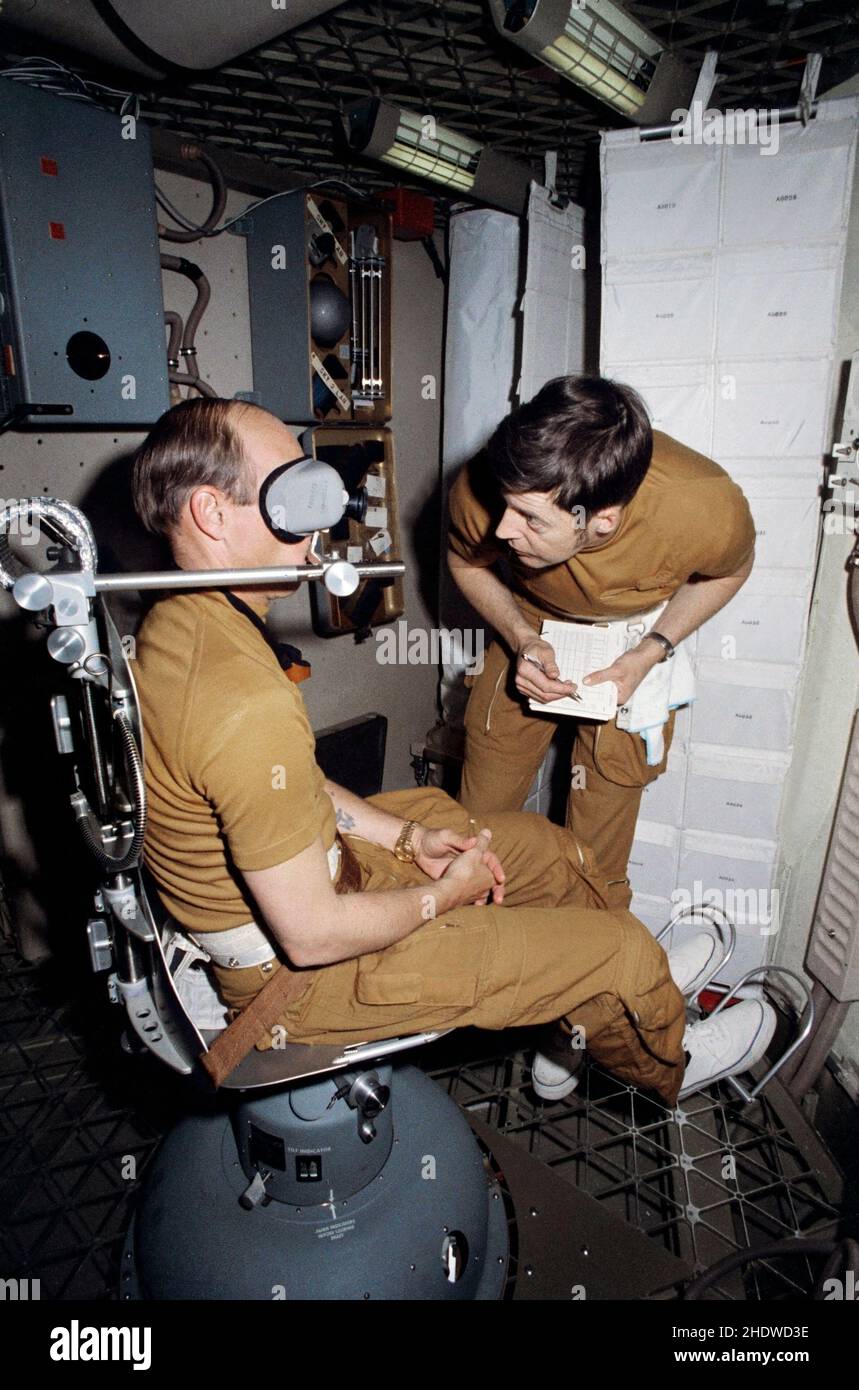 (1 March 1973) --- Astronaut Charles Conrad Jr., commander of the first manned Skylab mission, checks out the Human Vestibular Function, Experiment M131, during Skylab training at Johnson Space Center. Scientist-astronaut Joseph P. Kerwin, science pilot of the mission, goes over a checklist. The two men are in the work and experiments compartment of the crew quarters of the Skylab Orbital Workshop (OWS) trainer at JS Stock Photo