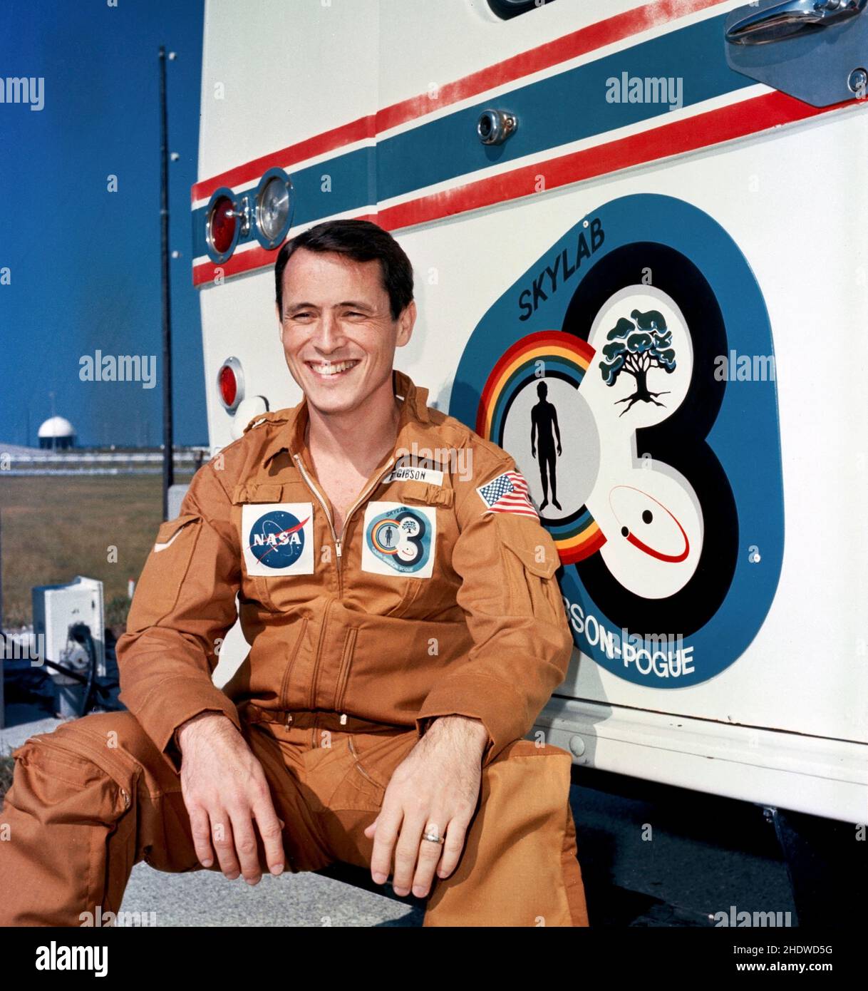 (8 Nov. 1973) --- Scientist-astronaut Edward G. Gibson, Skylab 4 science pilot, relaxes on the running board of the transfer van during a visit to the Skylab 4/Saturn 1B space vehicle at Pad B, Launch Complex 39, Kennedy Space Center, Florida. On the morning of the launch the transfer van will transport astronauts Gibson; Gerald P. Carr, commander; and William R. Pogue, pilot, from the suiting building to Pad B. Skylab 4, the third and last visit to the Skylab space station in Earth orbit, will return additional information on the Earth and sun, as well as provide a favorable location from whi Stock Photo