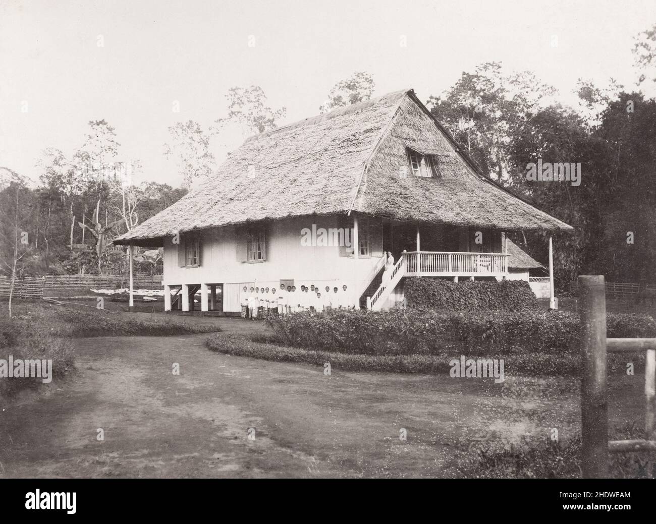 Vintage 19th century photograph: Dutch East Indies, Indonesia: colonial house and staff. Stock Photo