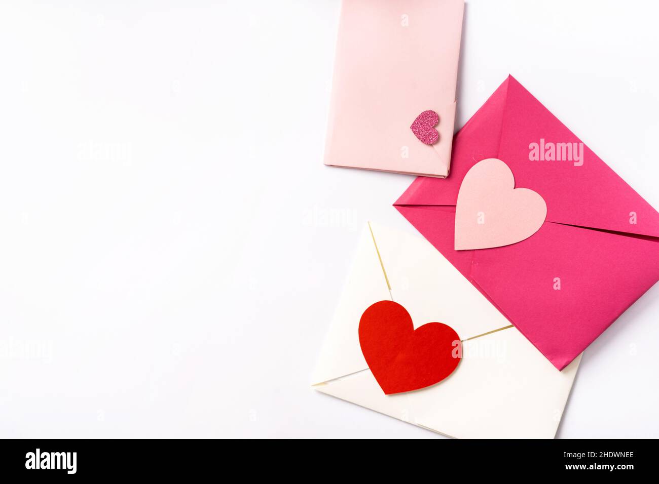 Pink, white and red love envelops on white background Stock Photo