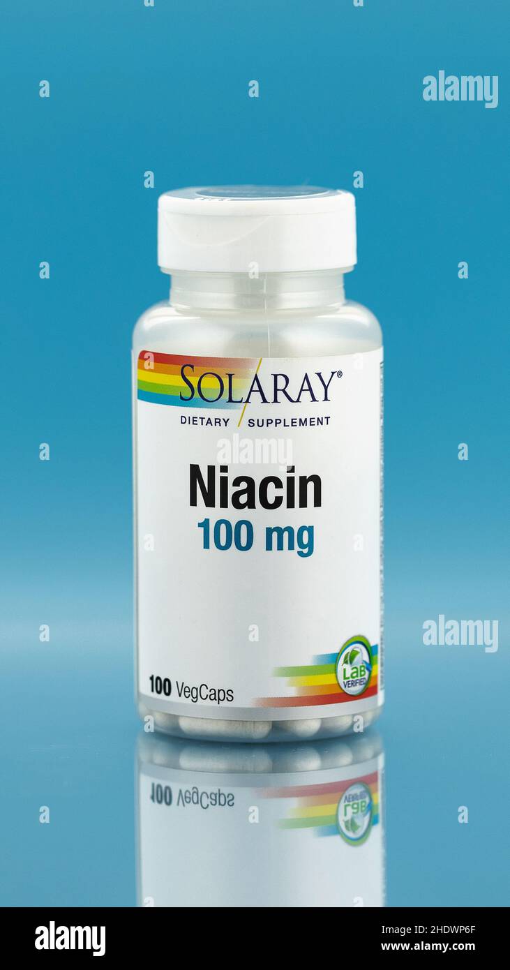 niacin capsules in the jar. dietary supplement editorial vertical photo