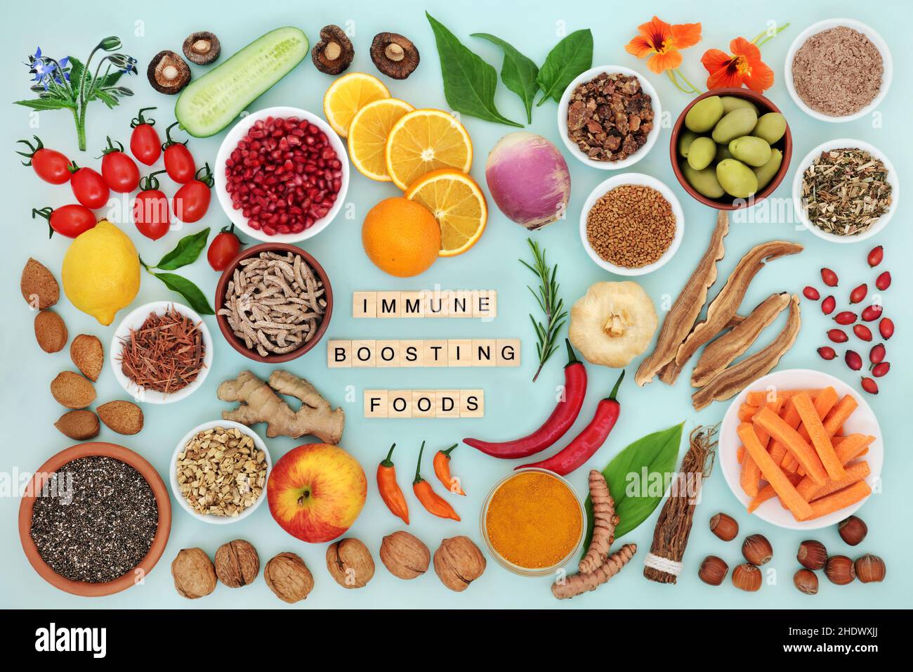 Immune system boosting vegan food for good health with vegetables, fruit, medicinal herbs and spice. High in antioxidants, anthocyanins, fibre. Stock Photo