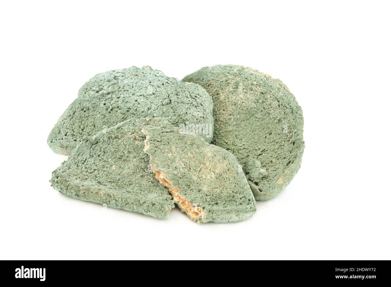 Out of date green mouldy bread slices on white background. Out of date