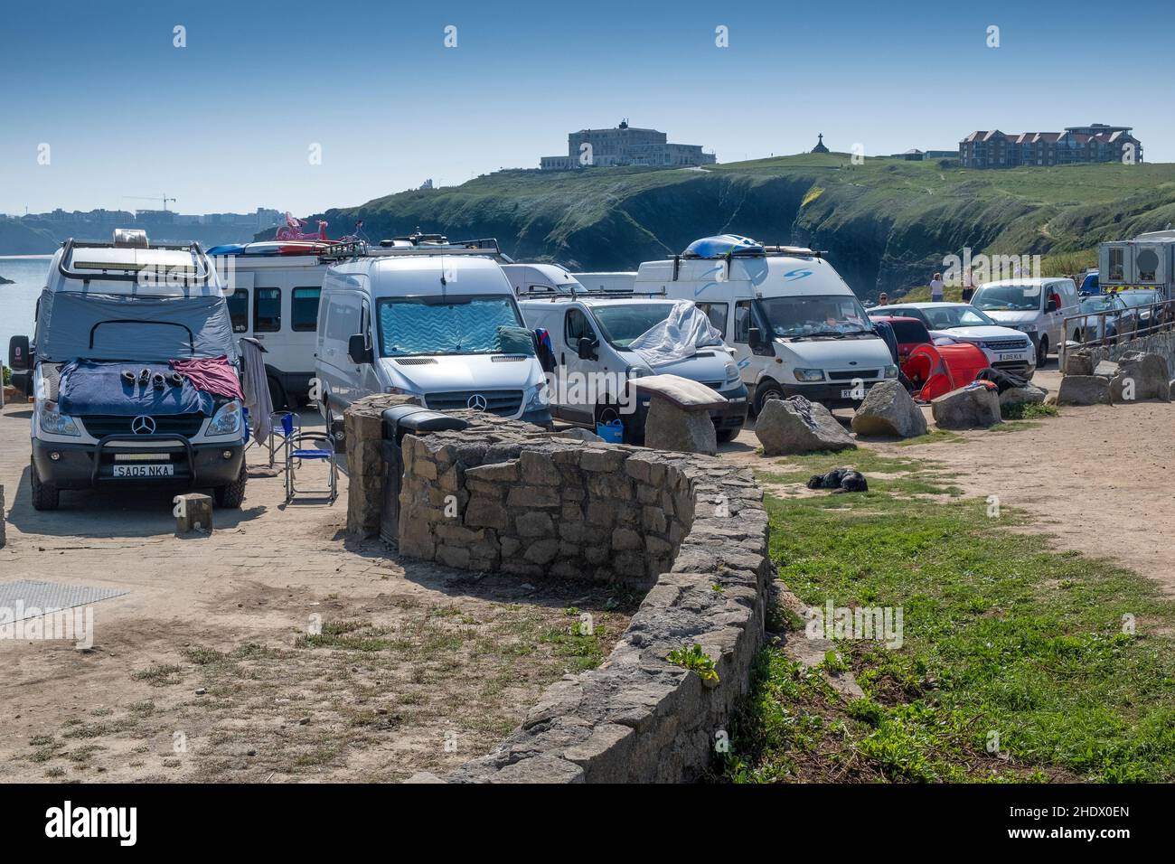 Van lifers and staycation holidaymakers fill the car park on Towan Head in Newquay in Cornwall. Stock Photo