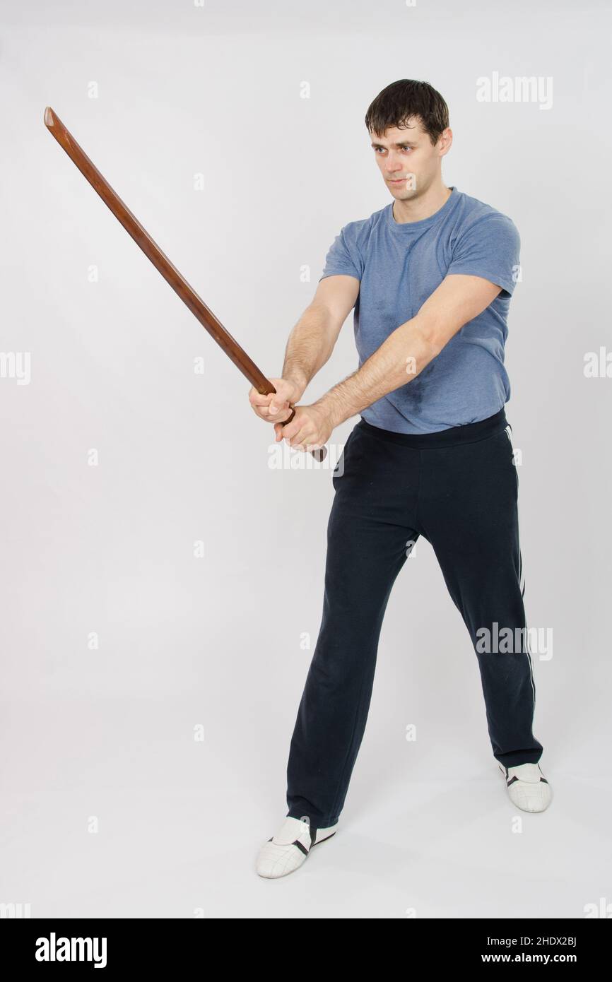 two men sparring with Filipino stick fighting martial arts Stock Photo