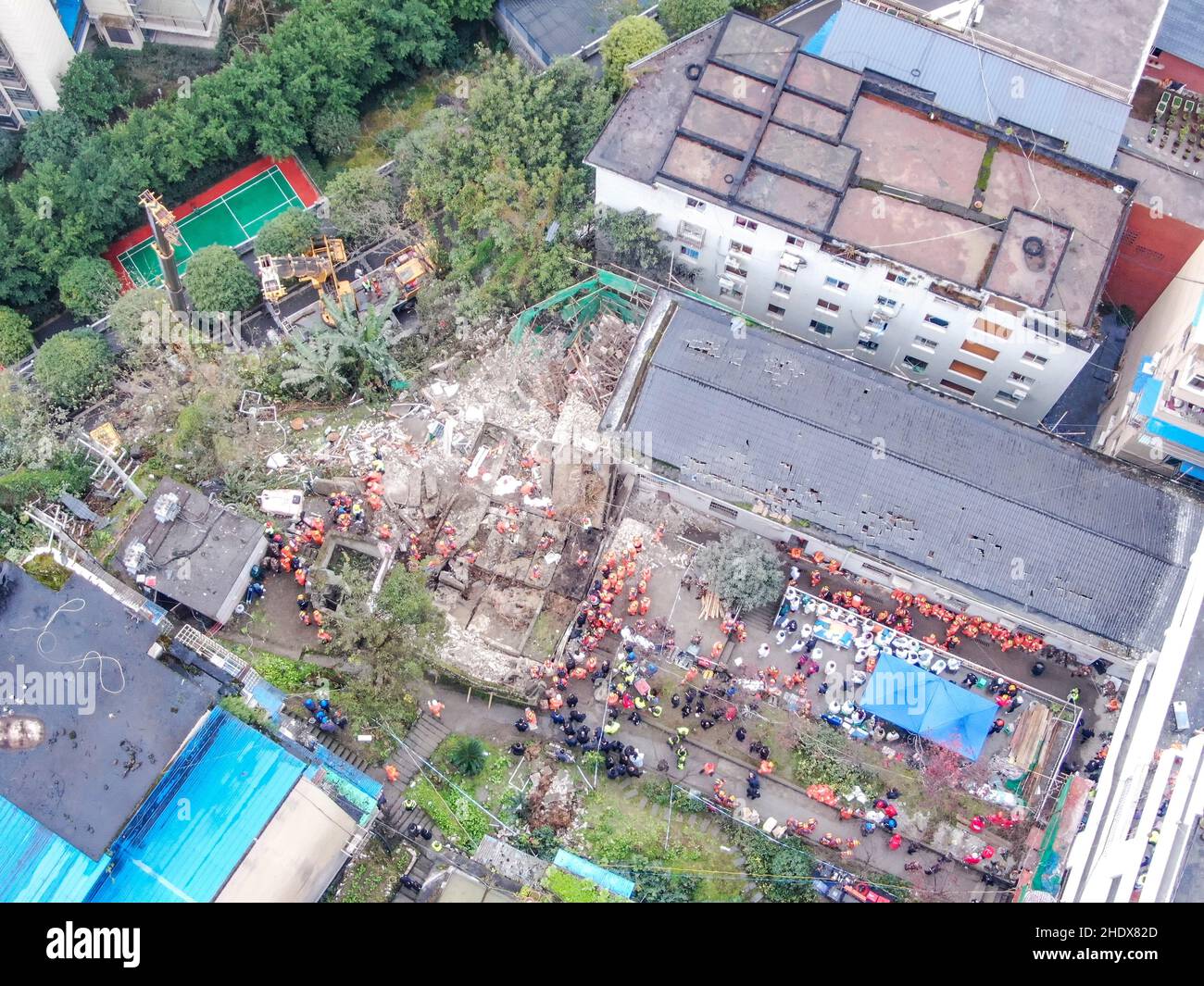 (220107) -- CHONGQING, Jan. 7, 2022 (Xinhua) -- Aerial photo taken on Jan. 7, 2022 shows the site of a blast in Wulong District, southwest China's Chongqing. More than 20 people were believed to have been trapped after a blast rocked a canteen of a subdistrict office in Wulong District, southwest China's Chongqing Municipality, on Friday noon. The accident took place at 12:10 p.m. due to suspected gas leakage which triggered the explosion and caused the collapse, said the municipal publicity department. According to witnesses, people were having lunch in the canteen when the blast took pl Stock Photo