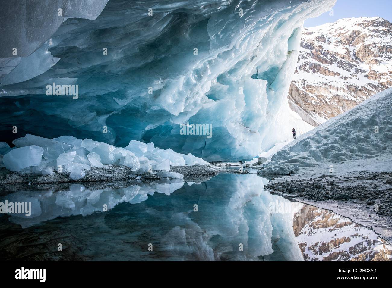 Ice cave exploration Stock Photo - Alamy