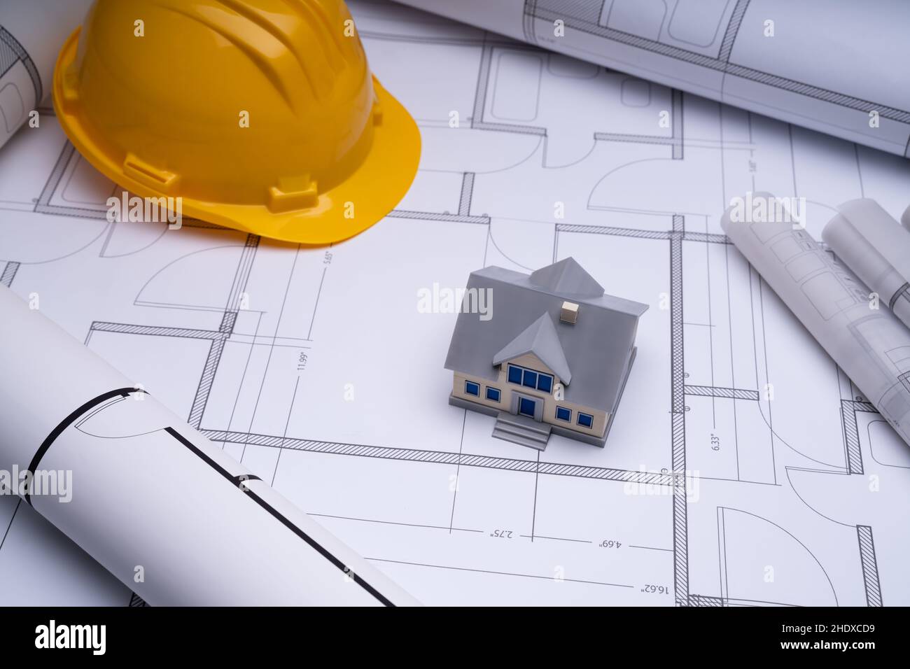 House Construction And Building Plans. Architect Hard Hat Stock Photo