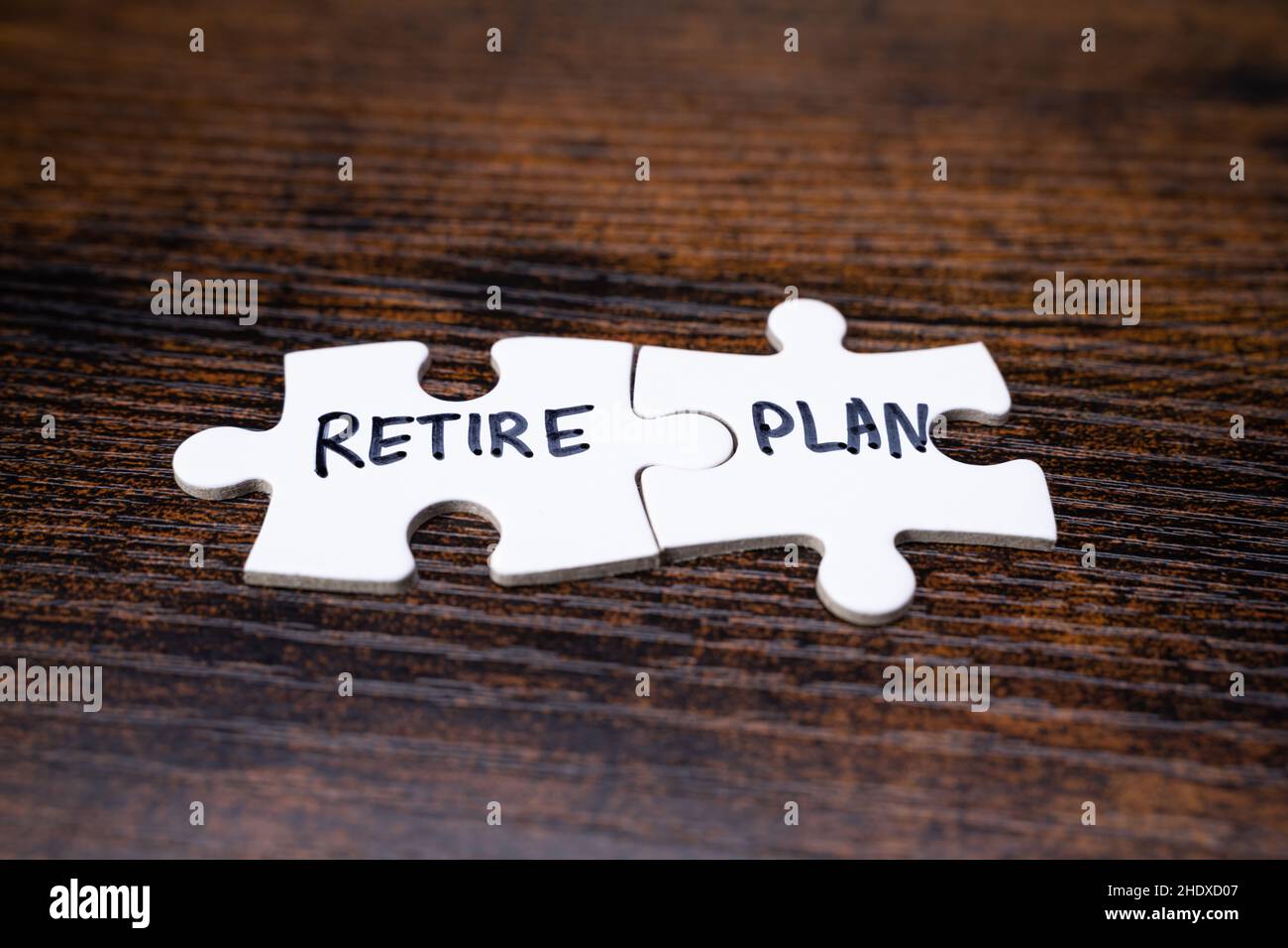 Pension Retire Planning With Jigsaw Pieces. Income Management Stock Photo