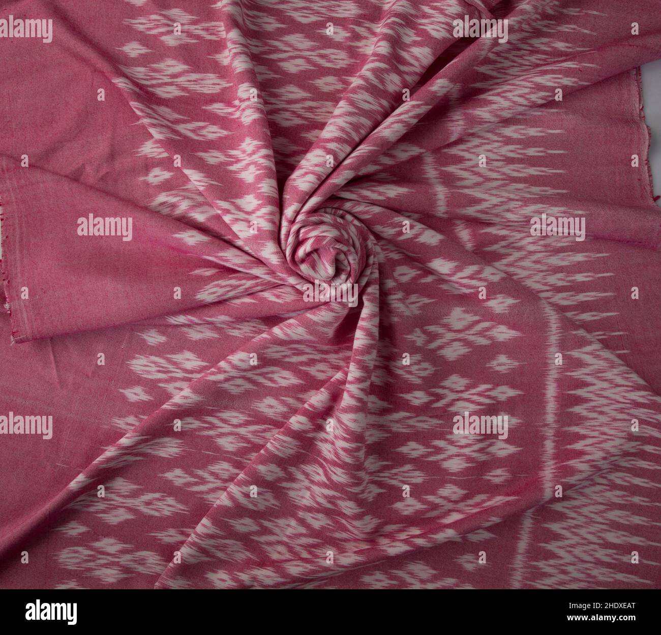 Pink color hand woven cotton fabric in Thai ancient style pattern. Top