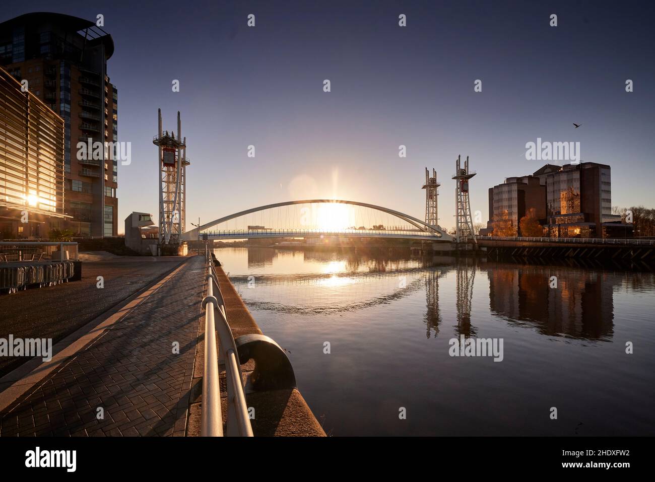 Quay House and the millenium bridge  on the Trafford banks of Salford Quays Stock Photo