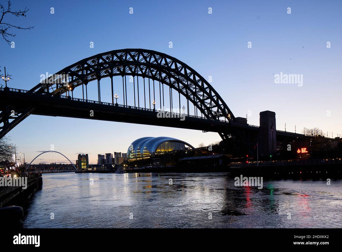 Early morning Newcastle upon Tyne landmark Tyne Bridge and Sage Gateshead on the banks of River Tyne Stock Photo