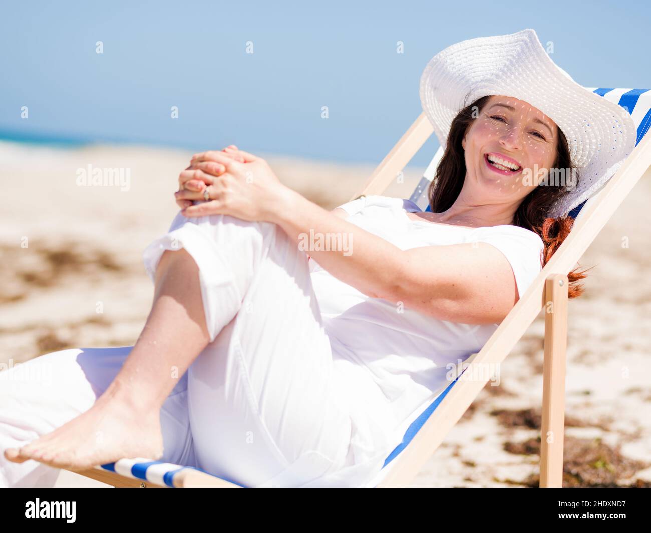 relaxing deck chair sunbathing relax relaxation deck chairs sun tanning sunbaking tanning Stock Photo Alamy