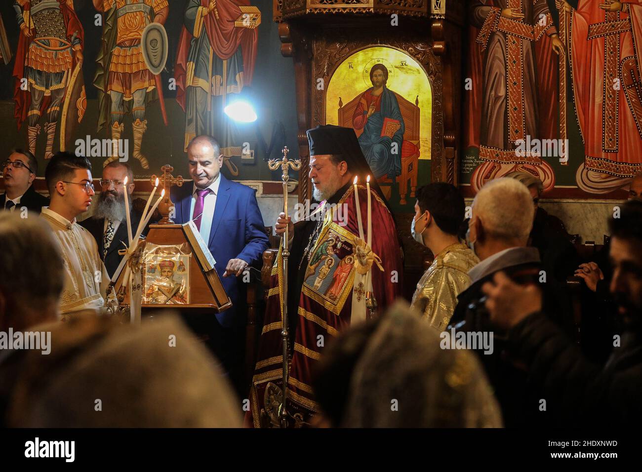 Palestinian worshippers from the Greek Orthodox community pray during