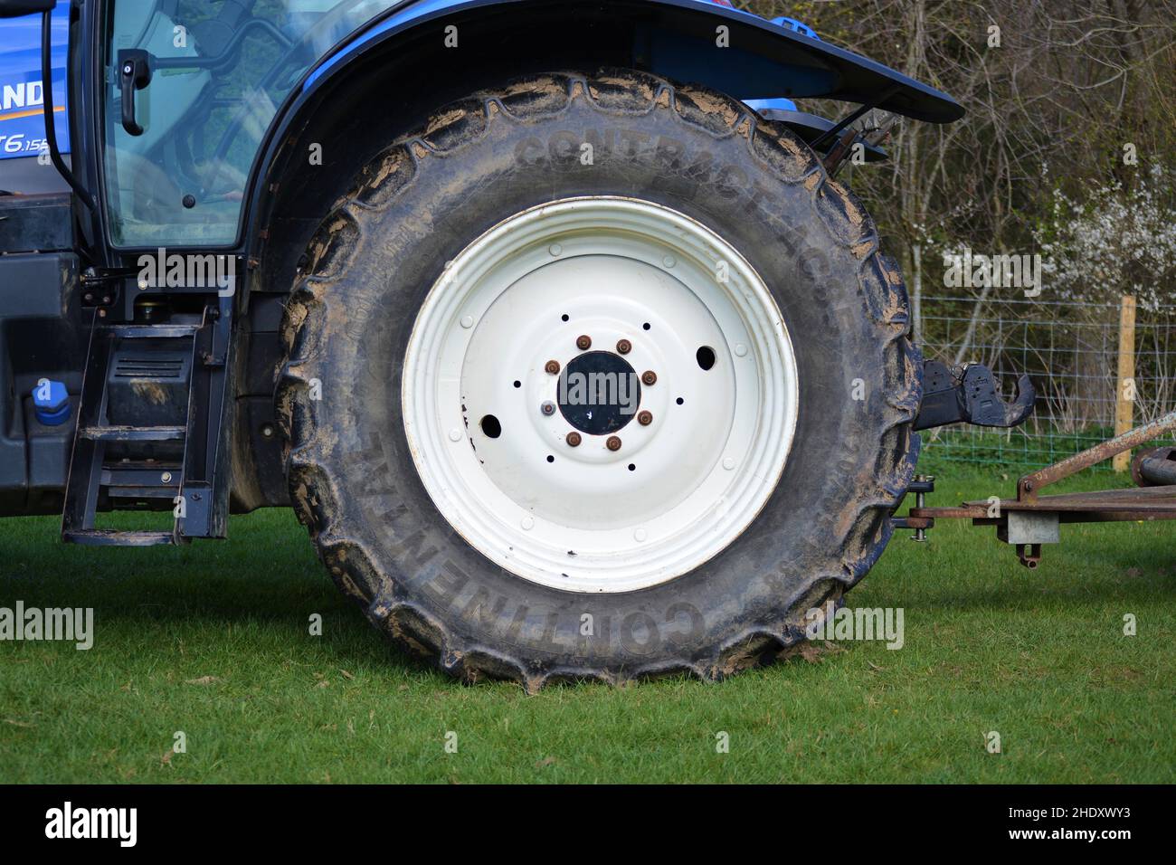 Big white tractor's wheel. Stock Photo