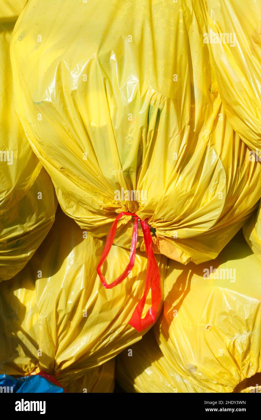 Yellow garbage bag hi-res stock photography and images - Alamy