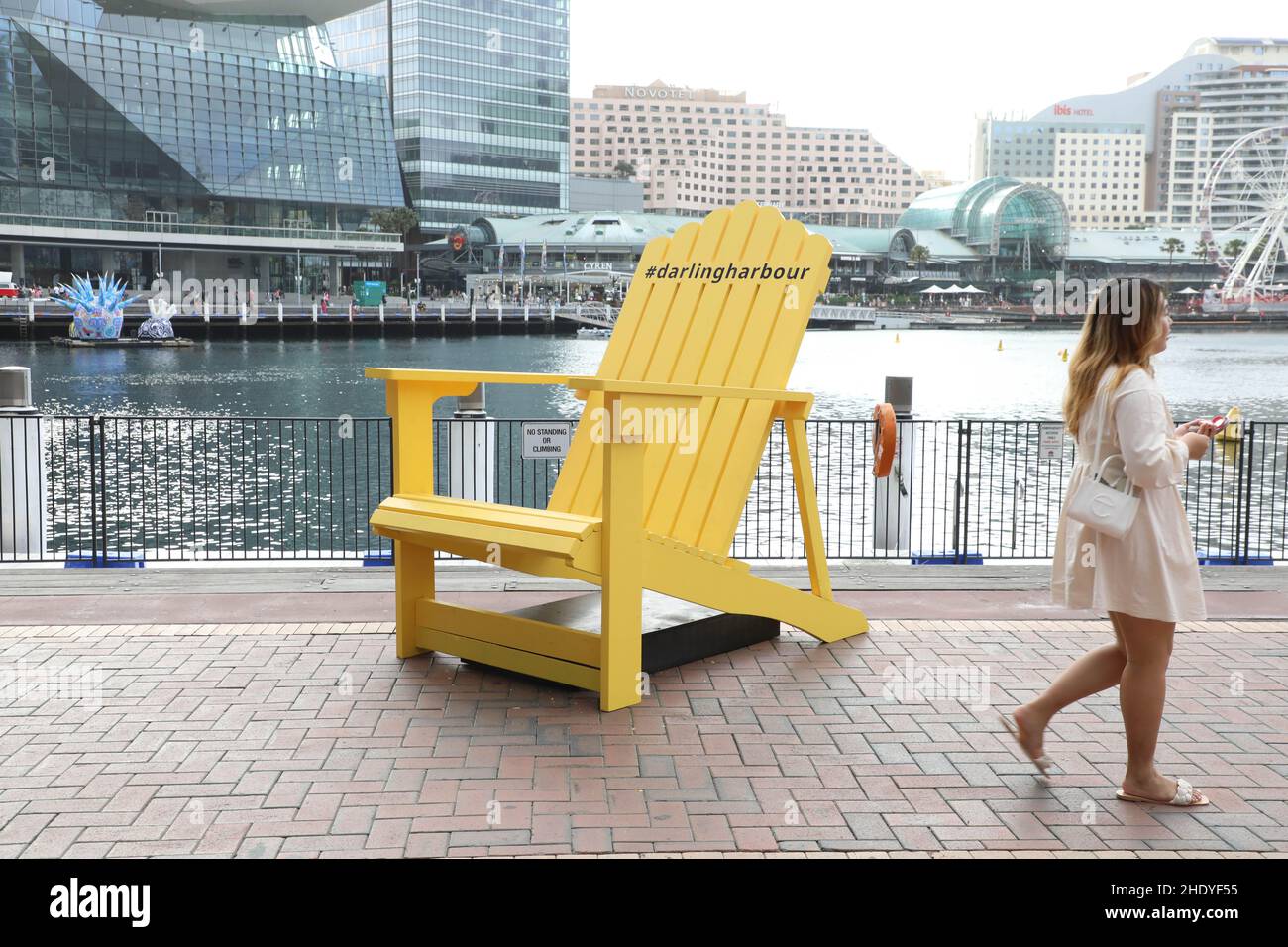 A large yellow deck chair in Darling Harboor, Sydney, Australia Stock Photo  - Alamy