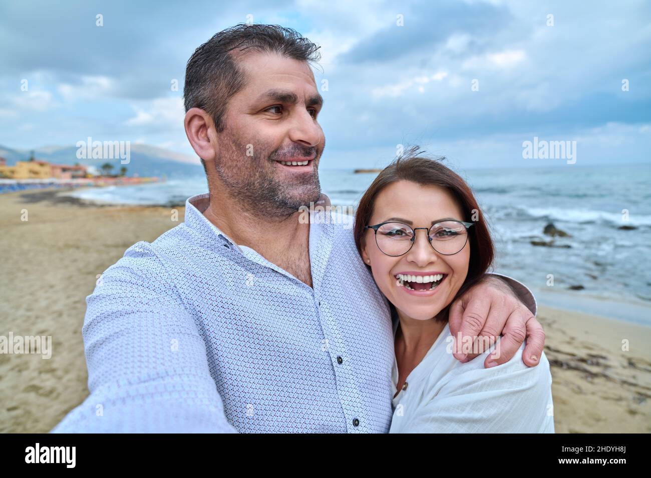 Happy mature couple taking selfie photo on smartphone. Stock Photo
