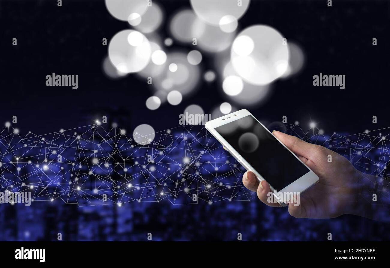 Technical Support Customer Service Business Technology Internet. and hold white smartphone with digital hologram data circles sign. Business network c Stock Photo