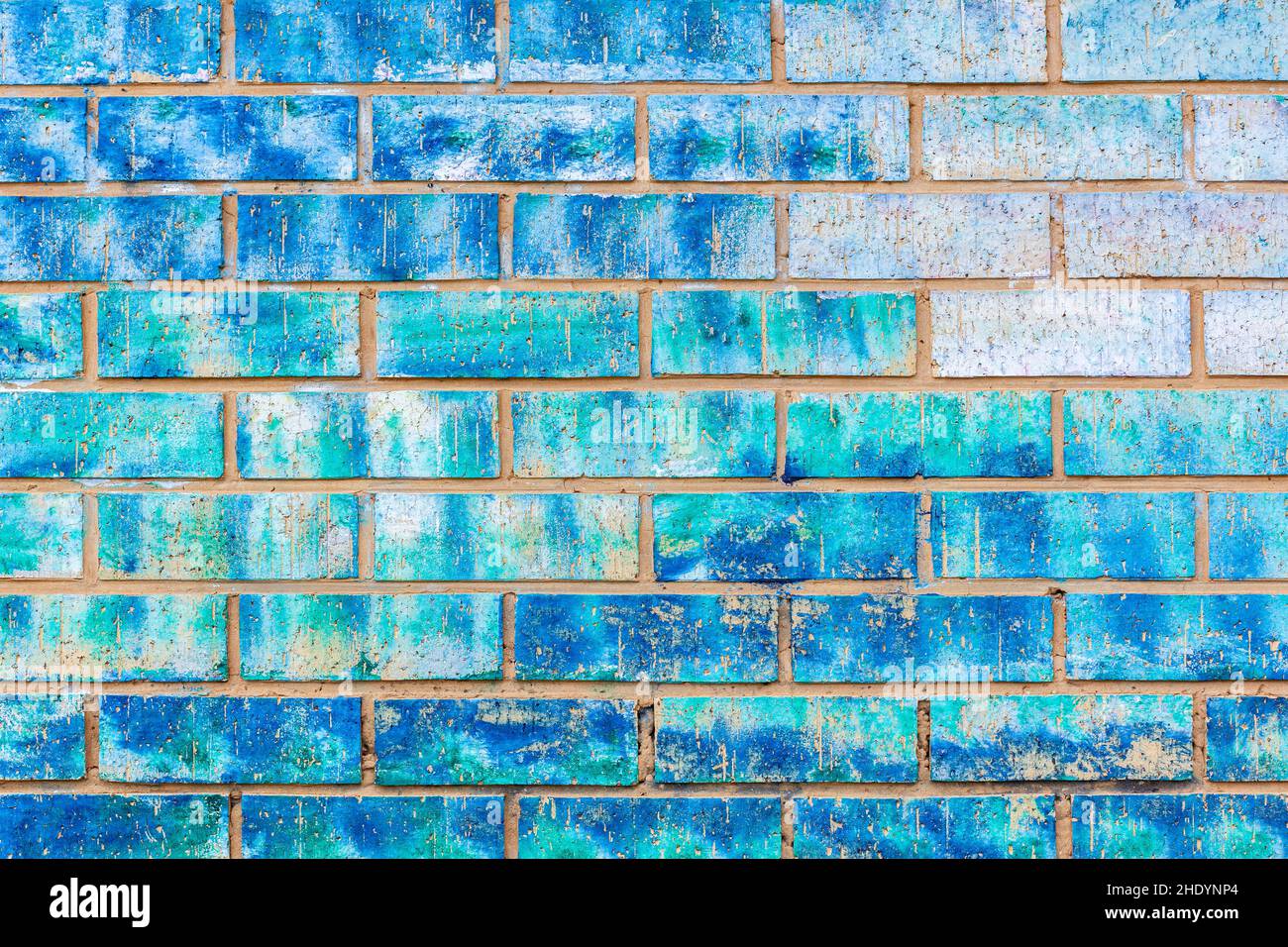 Wall closeup clay bricks plaster paint assorted of blue colors abstract