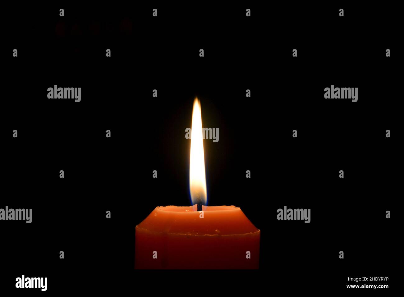 Candle lighting up the darkness Stock Photo Alamy