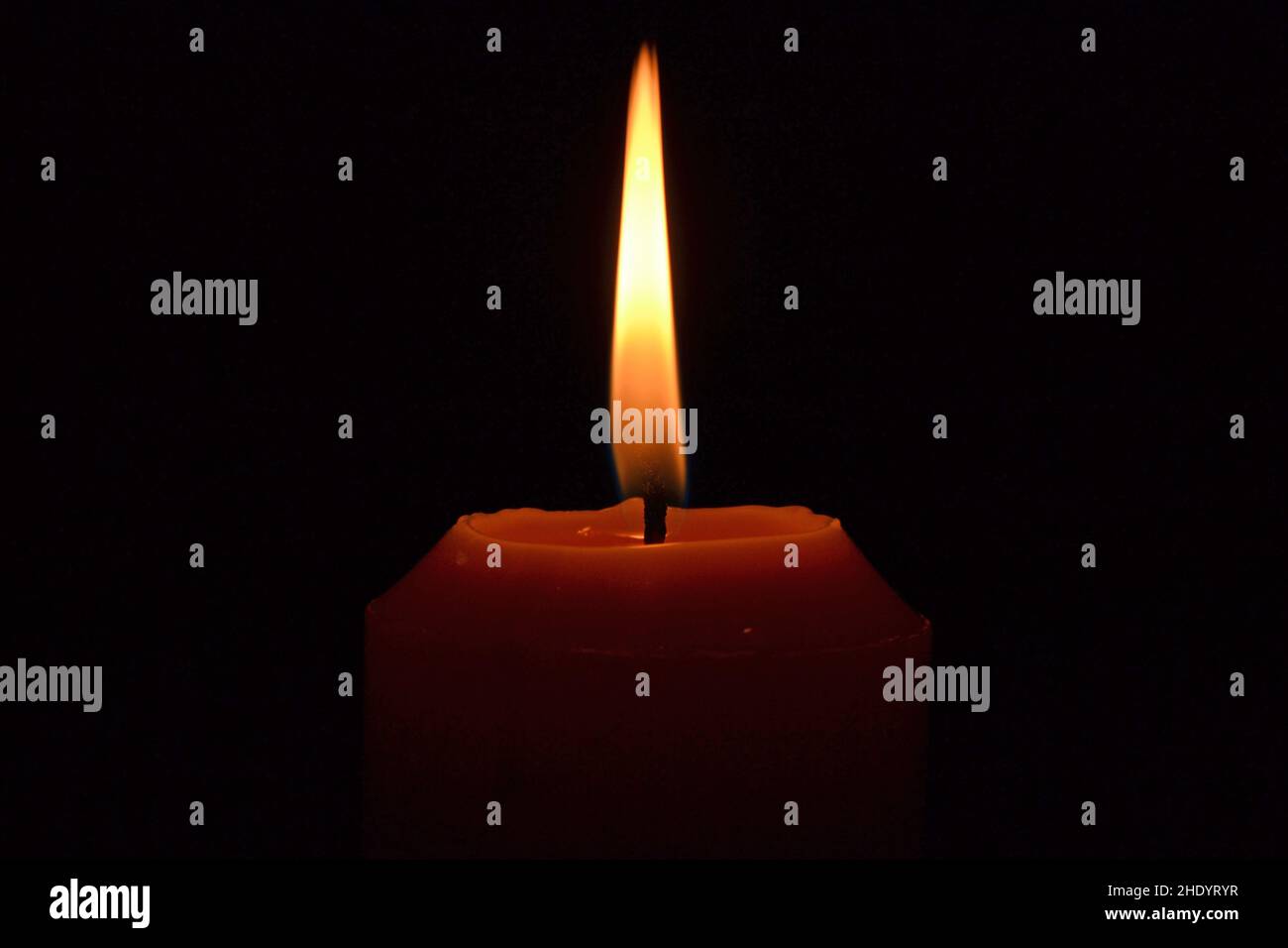 Candle lighting up the darkness Stock Photo Alamy
