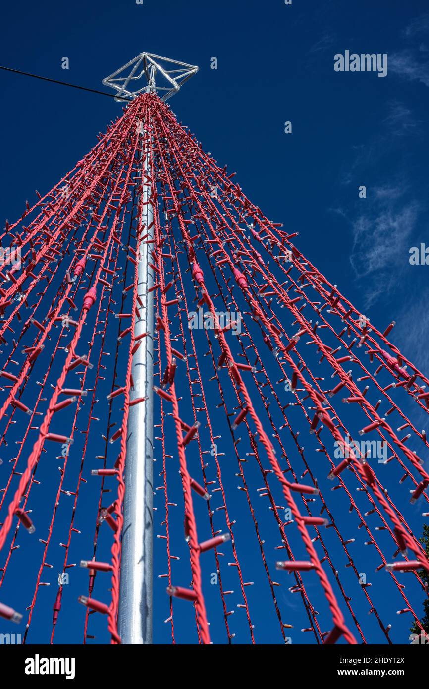 Christmas star atop red lighting string forming xmas tree shape in Chirche, Tenerife, Canary Islands, Spain Stock Photo